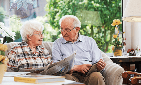 Long term tenants sitting on the sofa in their rental property