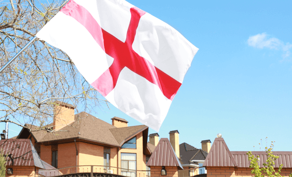 Landlord registration in England is mandatory. House in England with flag let under selective licensing scheme