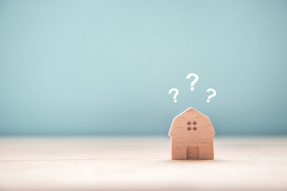 Wooden rental house with questions marks above about Right to Rent checks