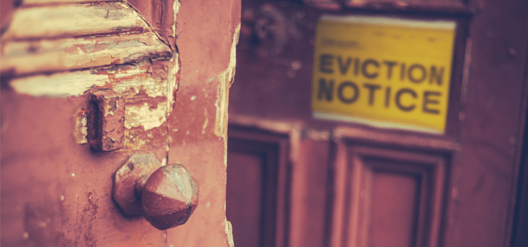 Yellow eviction notice on a door